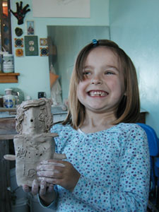 enthusiastic child holding finished piece